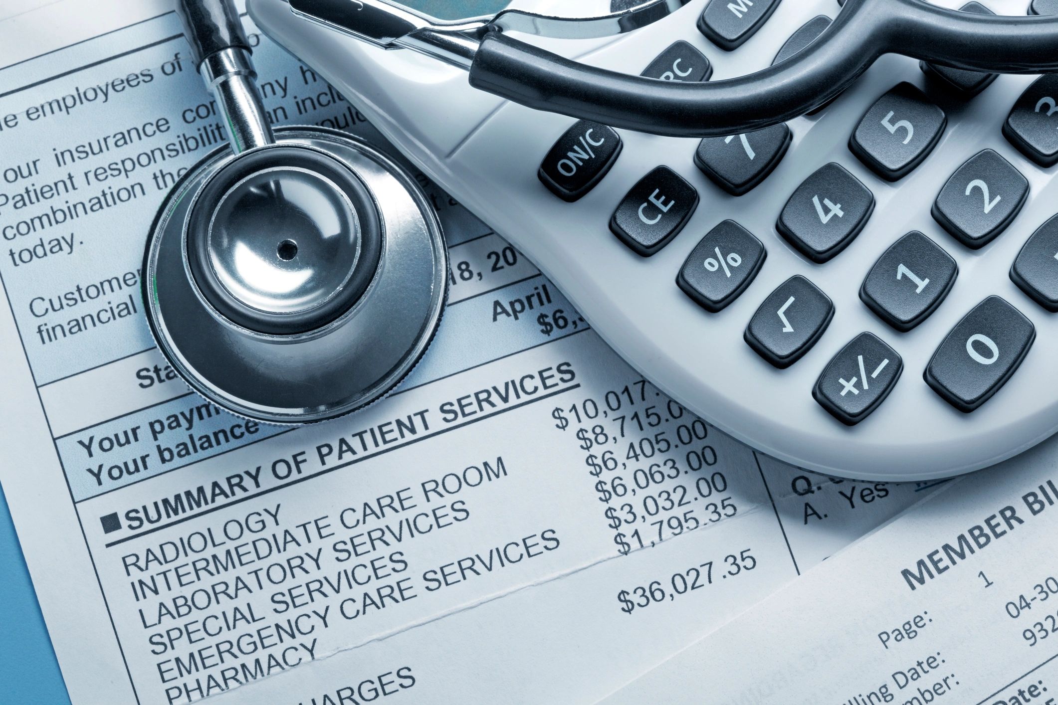 Medical cost concept with calculator and stethoscope